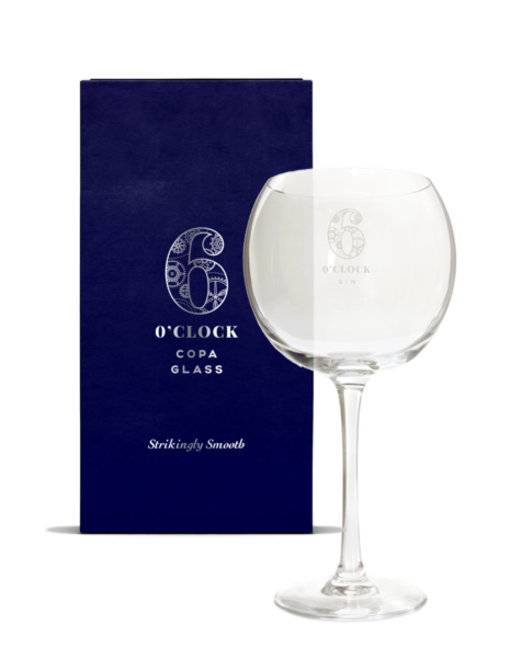 A copa glass in front of a card with the same name