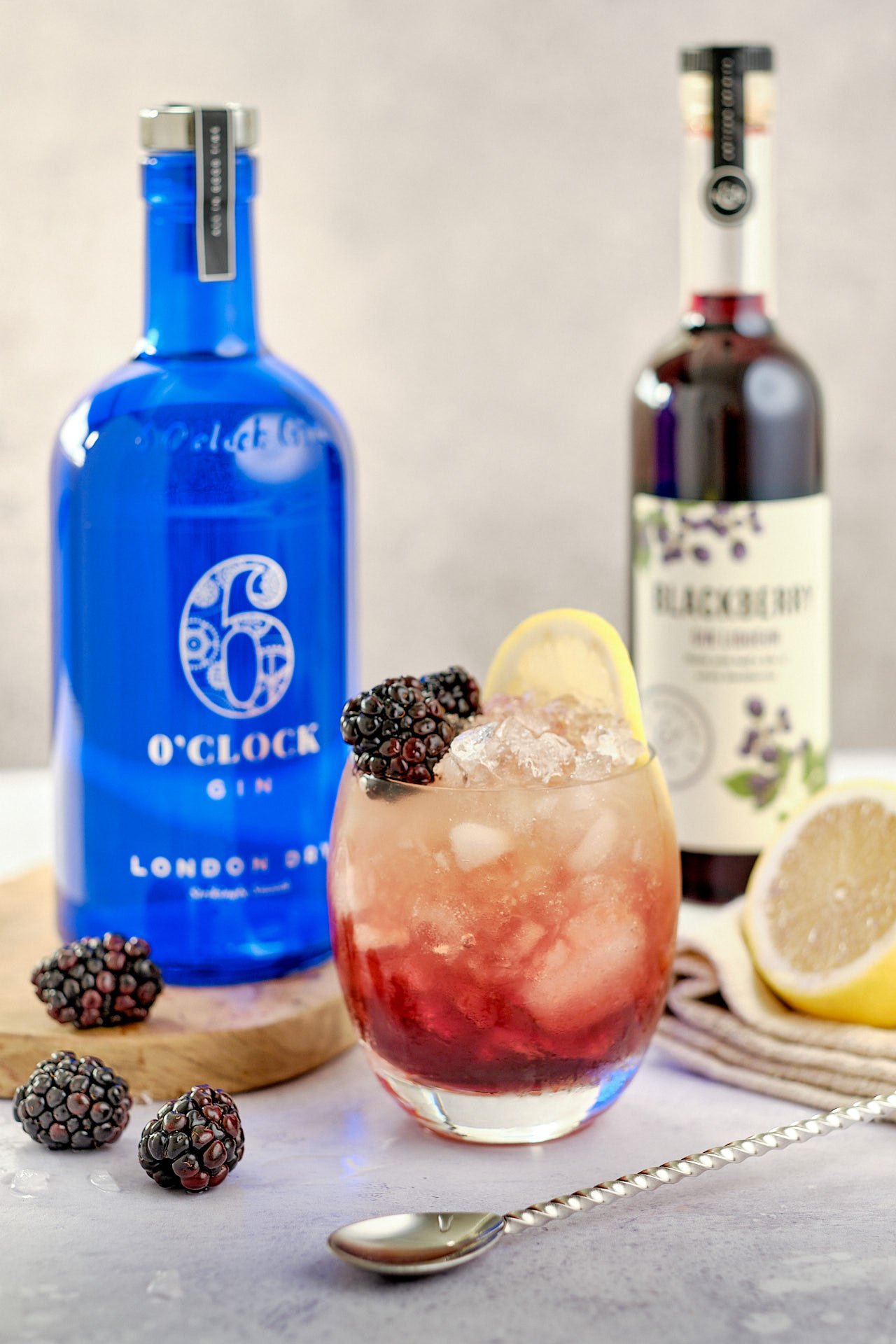 The Bramble Cocktail - made with gin, lemon and blackberry liqueur.